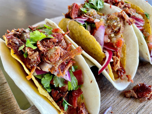 Jamaican jerk–seasoned Thor’s Hammer beef shank tacos featuring tender, slow-cooked shredded beef in tortillas, showing juicy smoked meat with bold Caribbean spices, citrus notes, and rich BBQ-style flavor.
