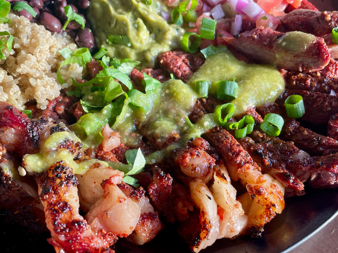Chili lime ribeye steak burrito bowl featuring sliced seasoned ribeye over grains with fresh vegetables and savory toppings, showing a vibrant, colorful bowl with zesty citrus-spiced steak and bold BBQ-inspired flavors.