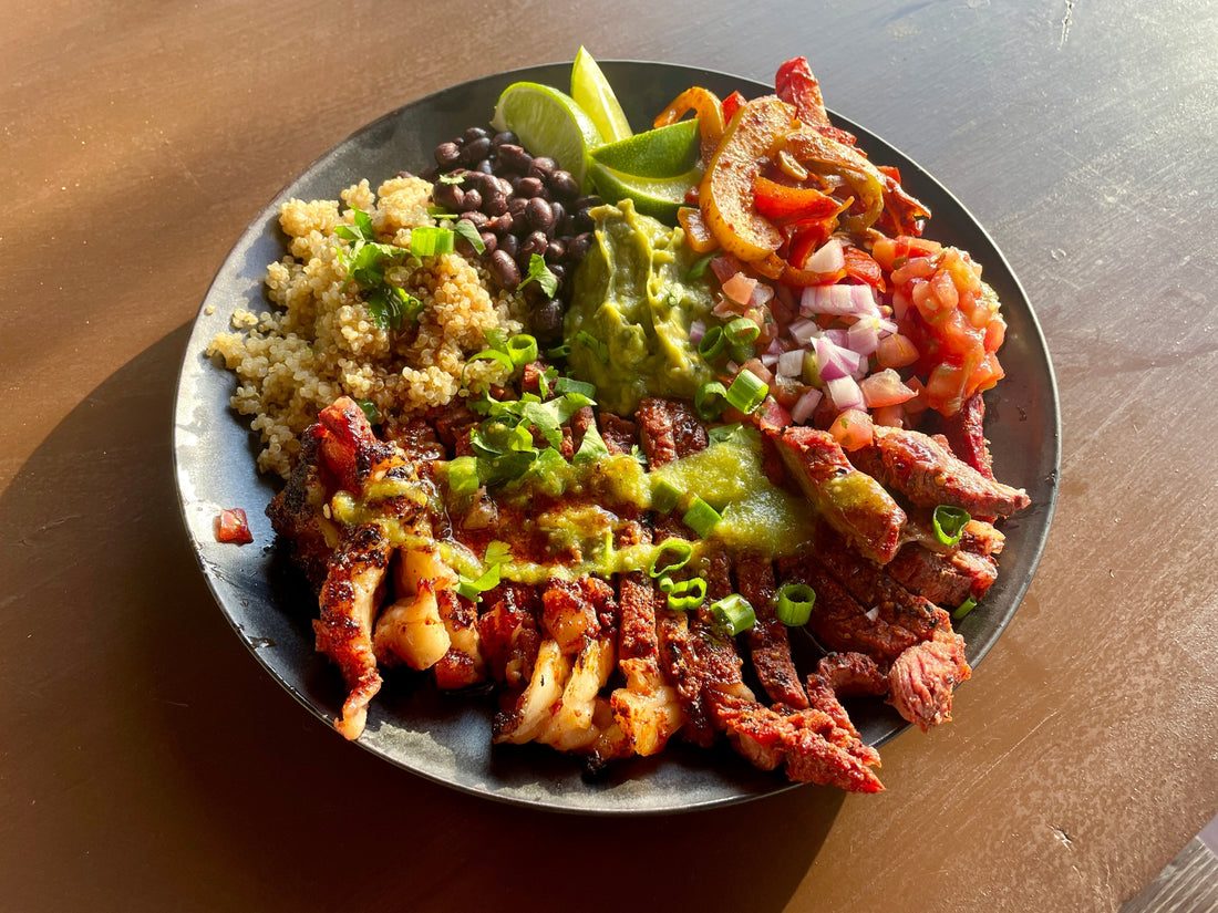 Grilled Jamaican jerk steak sliced over coconut rice and peas, topped with charred pineapple, fresh herbs, and a drizzle of creamy lime sauce, showing a vibrant bowl with smoky, sweet-heat Caribbean flavors Holy Smokers way.