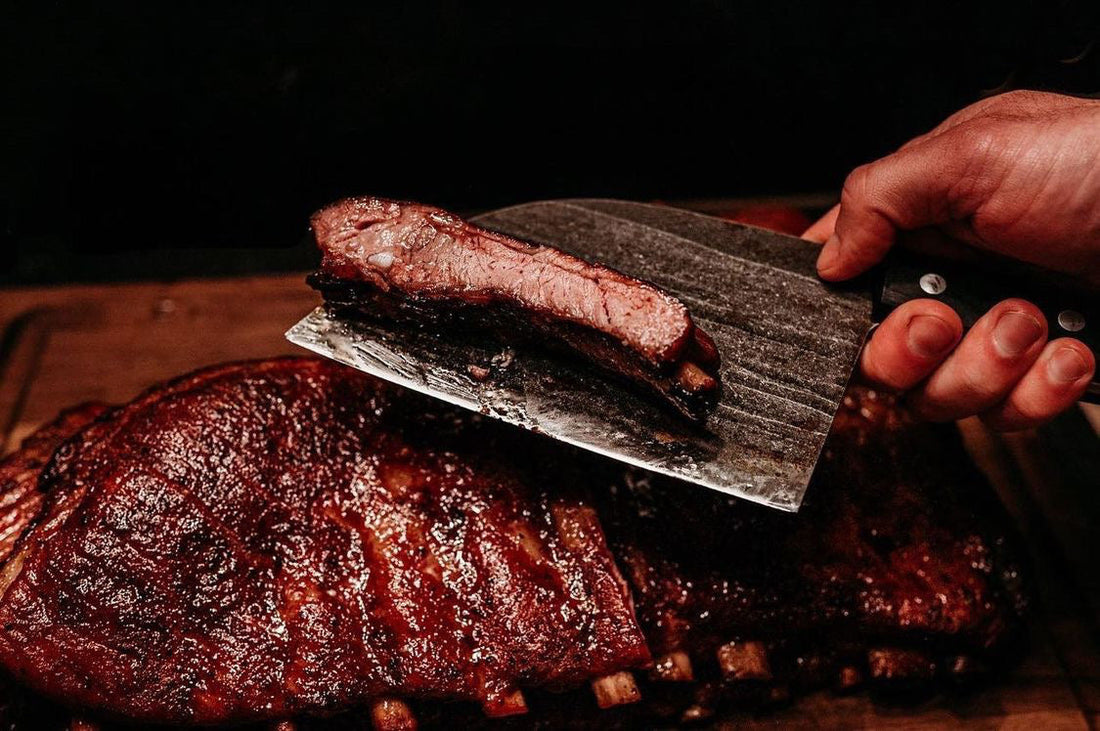 Smoked pork ribs coated in a nutty honey pecan BBQ rub, showing a glossy caramelized bark with a rich mahogany color and tender texture, presented as sweet and savory competition-style barbecue ribs.