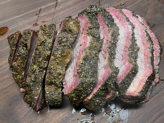 Hot and fast smoked brisket cooked over pecan wood, showing a barked exterior with a rich smoke ring and juicy sliced interior, seasoned with BBQ rubs for a tender, flavorful brisket prepared in a shortened cook time.