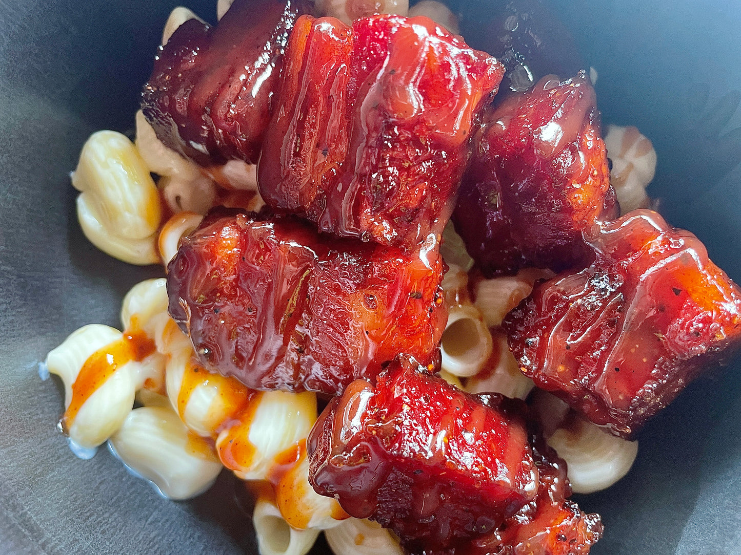 The best seasoning; this Bacon Honey Hog burnt ends over mac and cheese, perfect for any bbq competitions. 