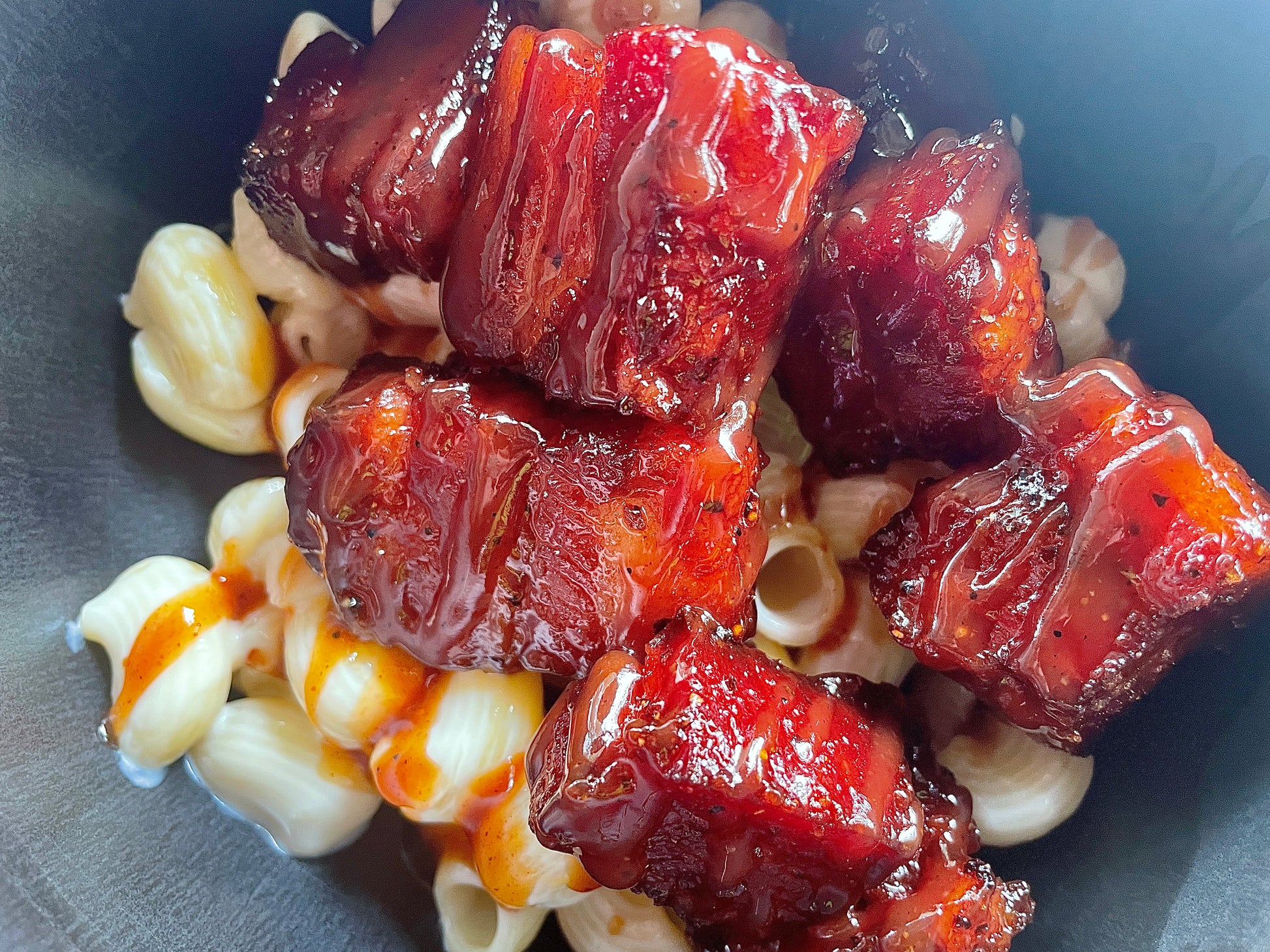 The best seasoning; this Bacon Honey Hog burnt ends over mac and cheese, perfect for any bbq competitions. 