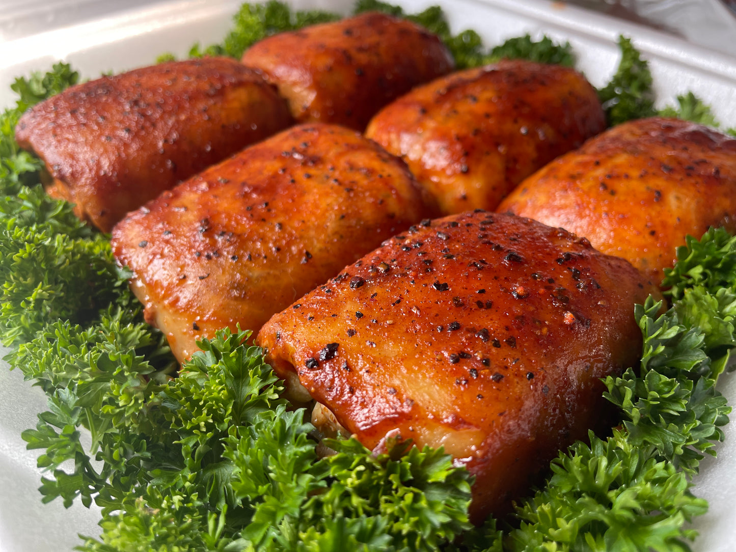 Chicken thighs seasoned with holy smokers rub companies gourmet bbq rubs.